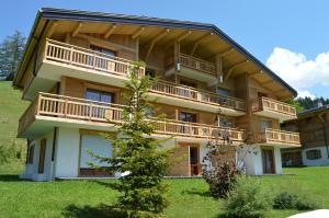 a large building with balconies on the side of it at VVF Résidence Megève Mont-Blanc in Megève