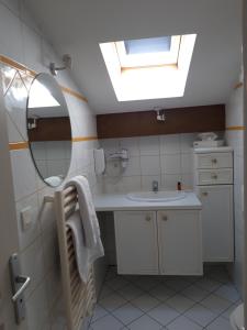 a bathroom with a sink and a mirror at La villa Du Port in Veyrier-du-Lac +48 photos