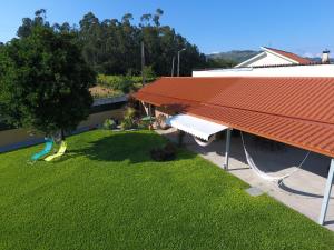 an overhead view of a house with a red roof at Casa flor da laranjeira in Ponte de Lima