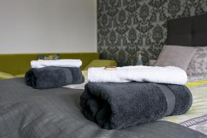 Postel nebo postele na pokoji v ubytování Luxusní Apartmán NMNM Family