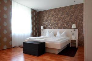Voodi või voodid majutusasutuse Stadthotel Gürtler toas