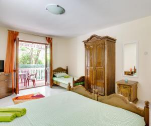 Letto o letti in una camera di Villa Dionis