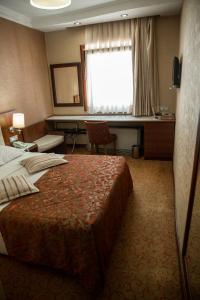 Postel nebo postele na pokoji v ubytování Yuksel Hotel