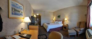 Postel nebo postele na pokoji v ubytování Humphry Inn and Suites