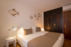 Säng eller sängar i ett rum på Villa Ca na Magdalena - La Goleta Hotel de Mar & Villas