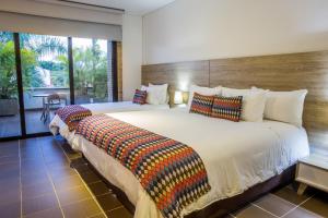 Ένα ή περισσότερα κρεβάτια σε δωμάτιο στο Alko Hotel Integrado
