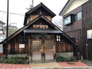 a wooden building with at Oyado Zen in Kusatsu