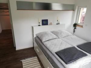 Un pat sau paturi într-o cameră la Kunz-Stücke
