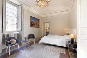 A bed or beds in a room at Palazzo Circolone