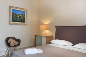 A bed or beds in a room at Palazzo Circolone