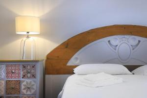 A bed or beds in a room at Palazzo Circolone