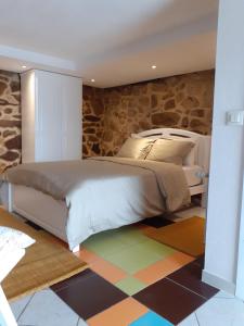 Ένα ή περισσότερα κρεβάτια σε δωμάτιο στο Hostal Casa Martinez