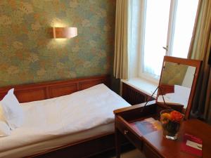 Postel nebo postele na pokoji v ubytování Boutiquehotel Oberkirch im Zentrum