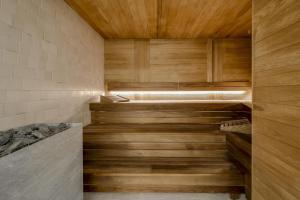 a room with a wooden floor and wooden walls at Grand Poet Hotel and SPA by Semarah in Riga