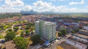 an overhead view of a city with a tall building at Hotel Vista Bela in Itamaraju