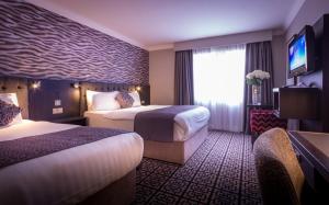 Postel nebo postele na pokoji v ubytování Talbot Hotel Stillorgan