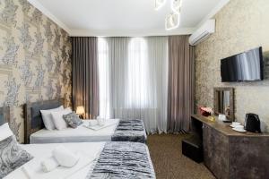 A bed or beds in a room at Hotel Makona