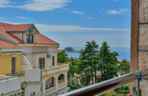 a view of the ocean from a building at Apartments Srzentic in Petrovac na Moru