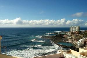 a view of the ocean from a building at Surfing the Blue II in Punta del Hidalgo +5 photos