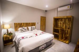 Postel nebo postele na pokoji v ubytování @HOsTEL PHANGAN