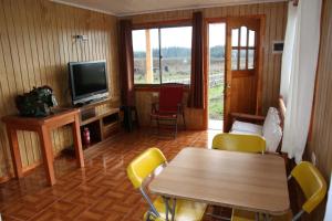 TV a/nebo společenská místnost v ubytování Laguna Verde Cabaña