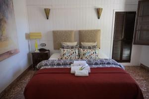 Postel nebo postele na pokoji v ubytování Villa Palmer I Beachhouse