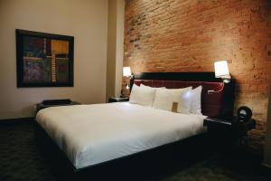 Cama ou camas em um quarto em Hotel Place D'Armes