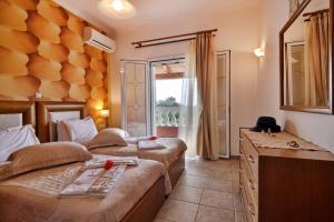 Postel nebo postele na pokoji v ubytování Angela Pool Apartments