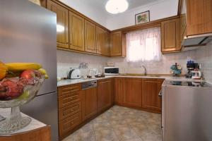 Kuchyň nebo kuchyňský kout v ubytování Angela Pool Apartments