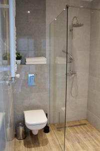 Ванна кімната в Apartamenty ZORZA