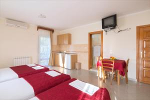 Postel nebo postele na pokoji v ubytování Apartments Konte