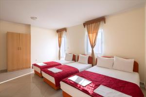 Postel nebo postele na pokoji v ubytování Apartments Konte + 37 fotografií