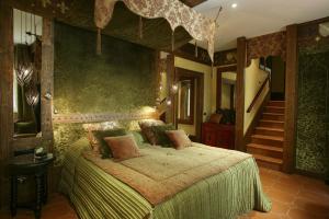 a bedroom with a bed in a room with stairs at Hotel Bernini Palace in Florence +130 photos