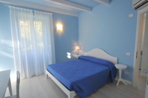 Postel nebo postele na pokoji v ubytování Villa Carolina