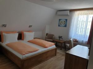 Posteľ alebo postele v izbe v ubytovaní Pansion Breza