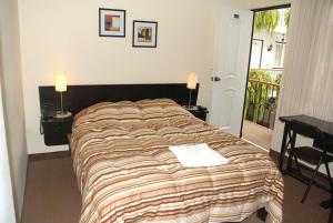 A bed or beds in a room at Residencial Carlos