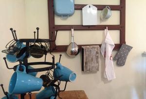 a room with a table and utensils on a wall at Pfarrhof Stuer in Stuer