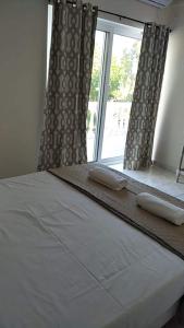 Postel nebo postele na pokoji v ubytování Joy Apartments Zakynthos