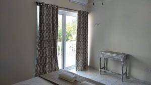 Postel nebo postele na pokoji v ubytování Joy Apartments Zakynthos