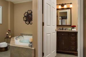 a bathroom with a tub and a sink at 1825 Inn Bed and Breakfast in Palmyra +38 photos
