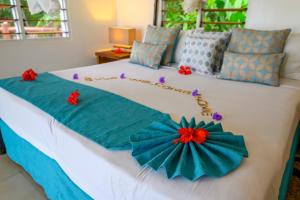 Кровать или кровати в номере Tropica Island Resort-Adults Only