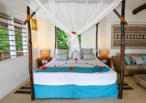 Кровать или кровати в номере Tropica Island Resort-Adults Only