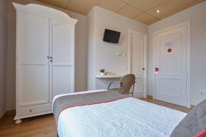 Cama o camas de una habitación en Hostal Nobadis