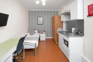 Kuchyň nebo kuchyňský kout v ubytování Flexistay Tulsi Aparthotel