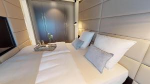 Postel nebo postele na pokoji v ubytování White Pearl Apartment 2.10