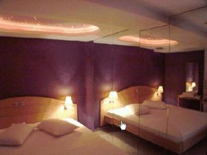 Posteľ alebo postele v izbe v ubytovaní Hotel Niki Piraeus