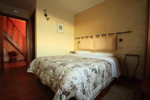Ένα ή περισσότερα κρεβάτια σε δωμάτιο στο La Candeletta
