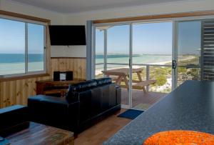 a living room with a view of the ocean at Ceduna Shelly Beach Caravan Park in Ceduna