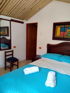 Кровать или кровати в номере Hospedaje Villa Isabel