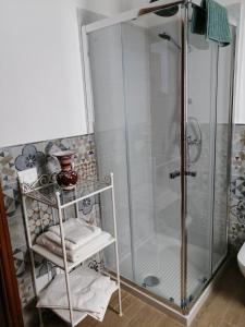 a shower stall with a glass door in a bathroom at Villa Piera in Mondello